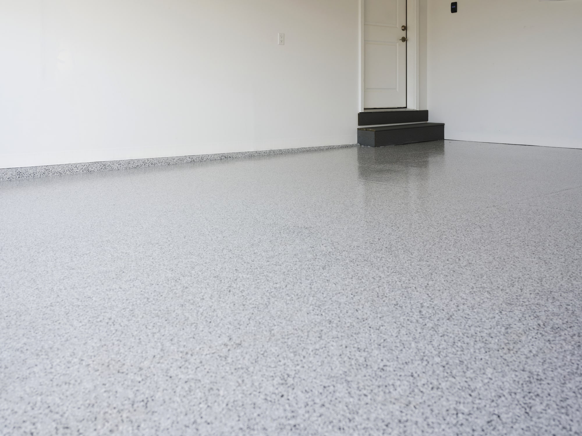 Epoxy and Polyaspartic Floor Coating vs. 6 Other Garage Flooring Options